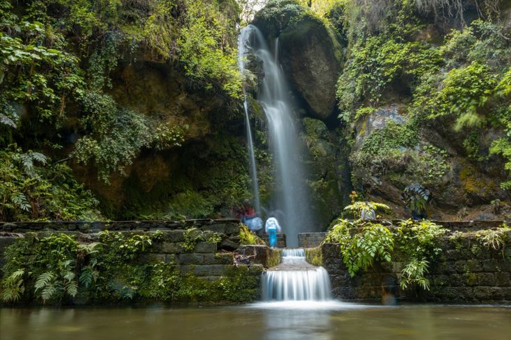 Beautiful Jibhi Waterfall in Himachal Pradesh surrounded by lush greenery